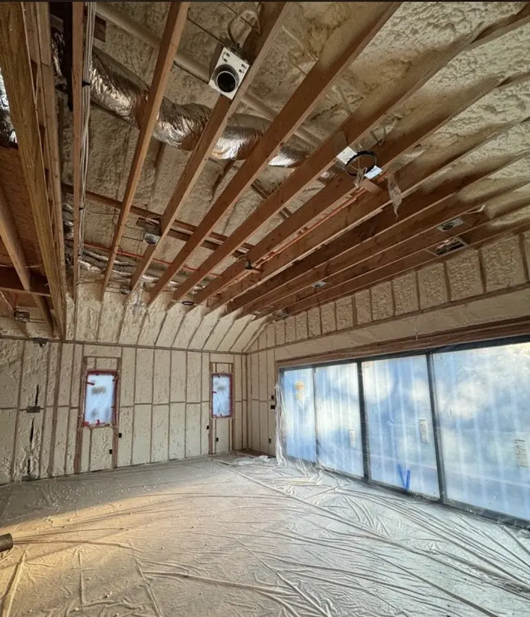 Interior walls and ceiling insulated with spray foam during new construction in Azalea Park